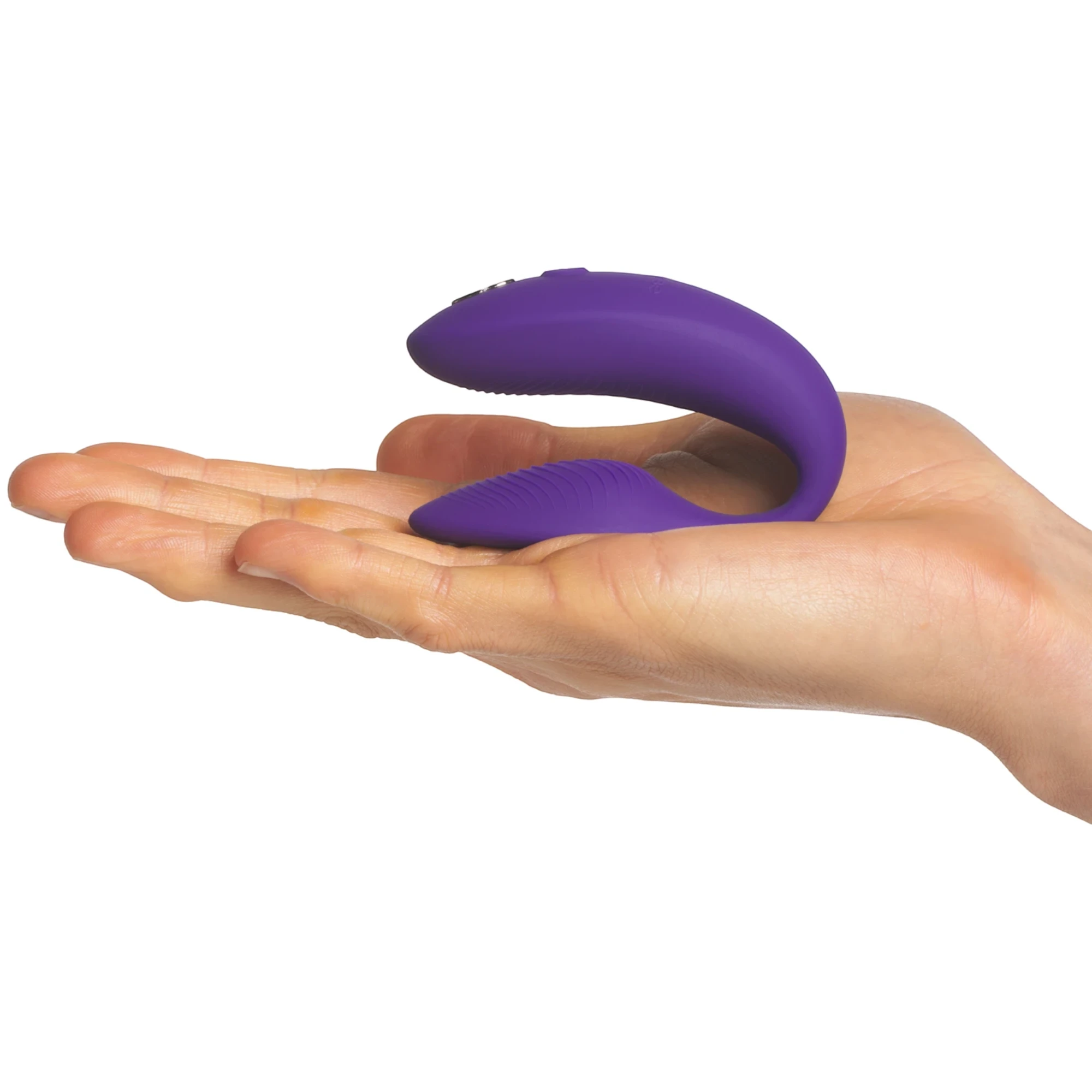 We-Vibe Sync 2 purple couples vibrator resting on open hand against white background