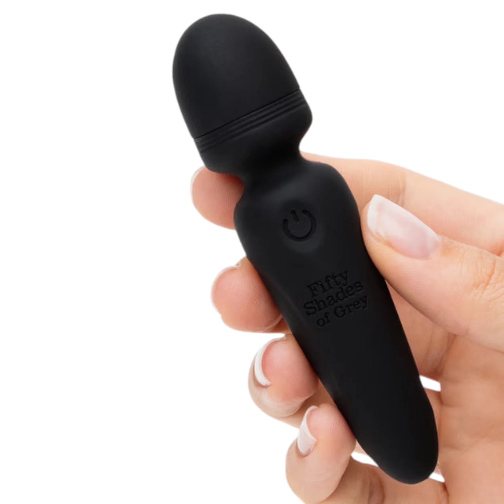 Fifty Shades of Grey Sensation black rechargeable mini wand vibrator held in hand displaying rounded bulbous head, textured grip band, power button icon, embossed product branding, and compact handheld size against white background