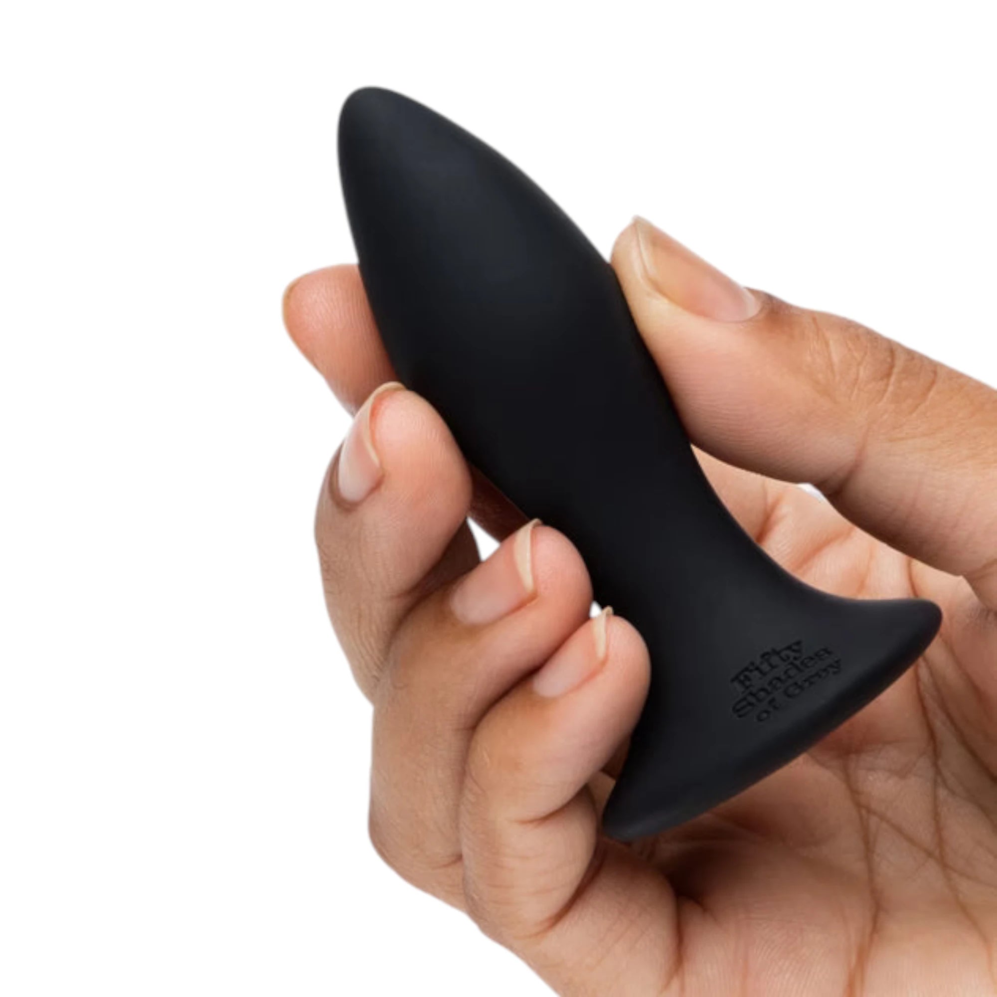 Fifty Shades of Grey Sensation rechargeable vibrating butt plug in black silicone held in hand displaying tapered elongated tip, wide suction cup base with Fifty Shades of Grey branding, and smooth finish against white background