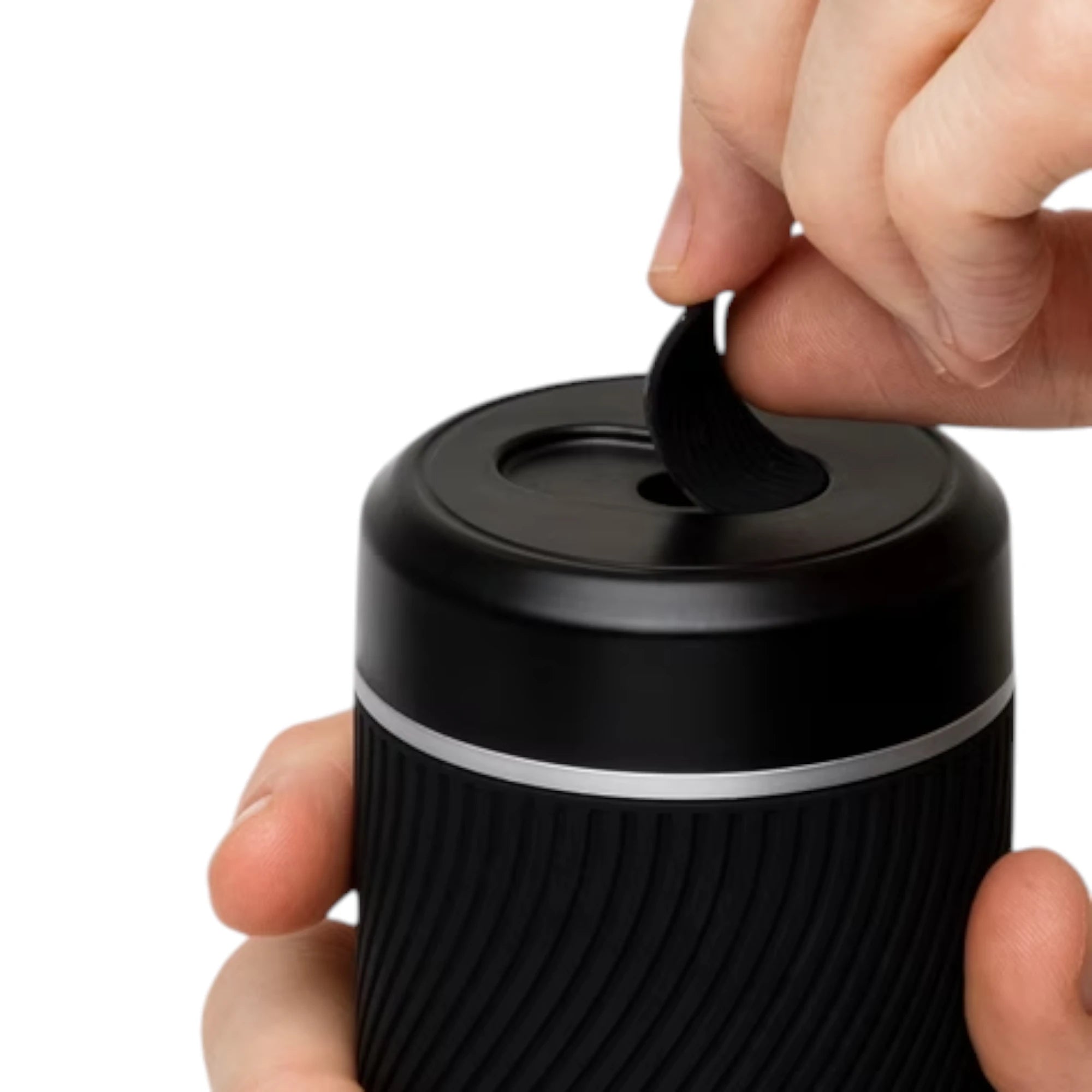 Arcwave Pow black silicone dual-entrance suction control male masturbator held in hands showing top opening with removable silicone insert being lifted out against white background