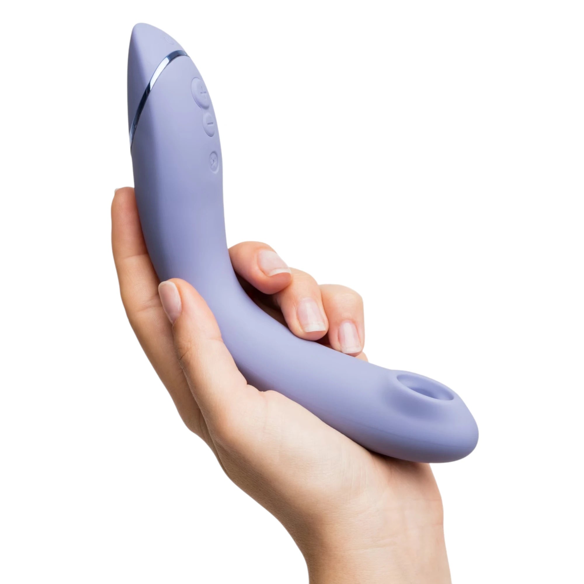 Womanizer OG Pleasure Air G-spot stimulator in light purple shown held in a hand, highlighting the curved ergonomic shape, metallic accent band, side control buttons and the Pleasure Air nozzle opening at the tip against a white background.