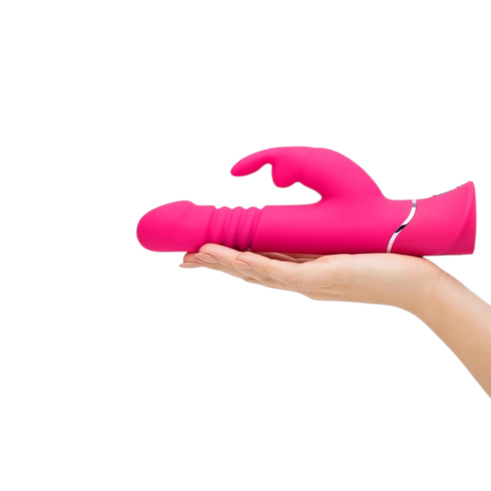 Happy Rabbit thrusting realistic rabbit vibrator in hot pink held in hand displaying rounded realistic head, ribbed collar detail, external rabbit ear stimulator, white accent band, and smooth silicone finish