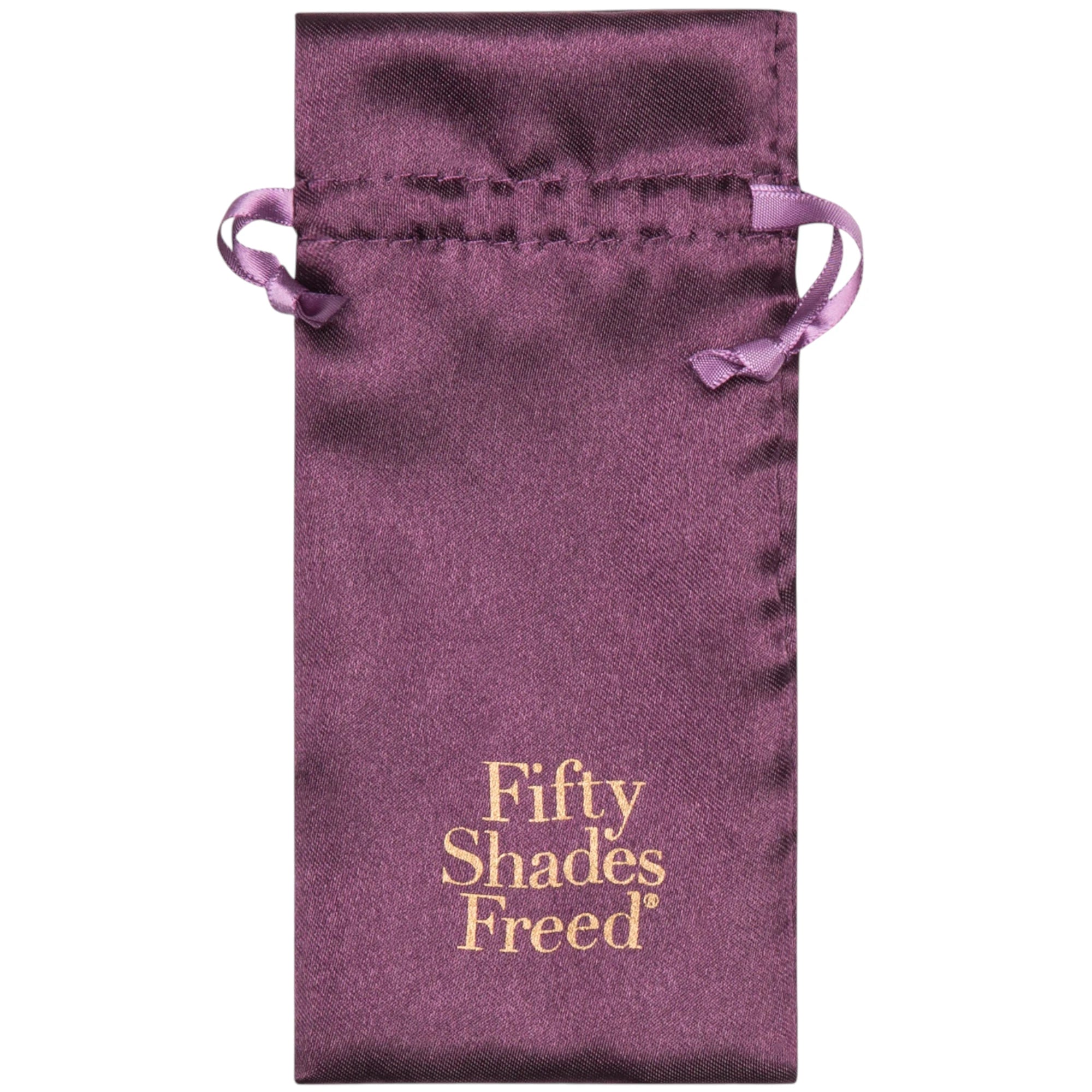 Fifty Shades Freed satin storage pouch in purple with drawstring ties, showing the gold “Fifty Shades Freed” logo printed on the front against a white background.