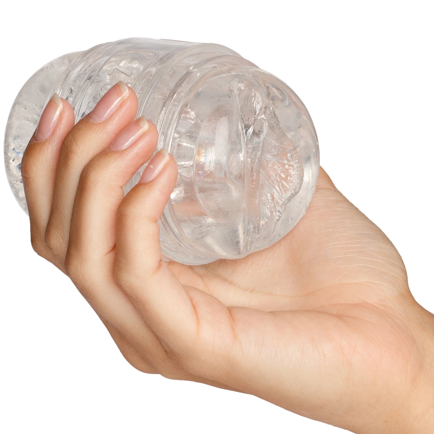 Fleshlight Quickshot textured male masturbator held in hand displaying clear transparent case with ribbed internal texture detail against white background