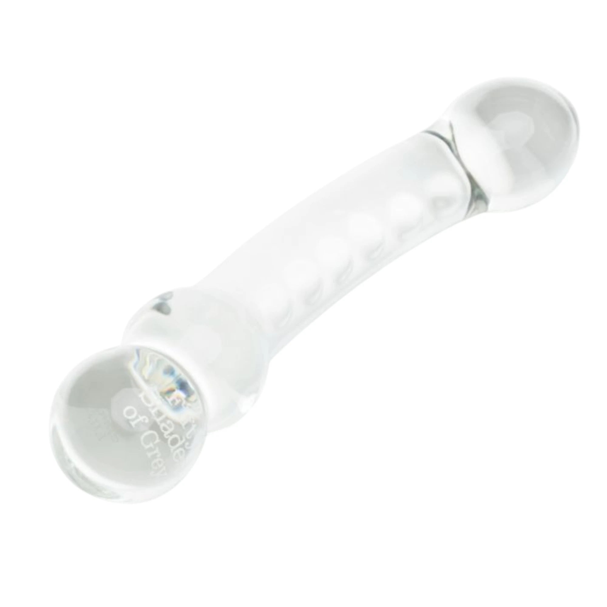 Fifty Shades of Grey Drive Me Crazy clear glass massage wand shown from angled view displaying smooth curved shaft, rounded bulb tip, textured grip bumps along side, double rounded base, and Fifty Shades branding detail against white background