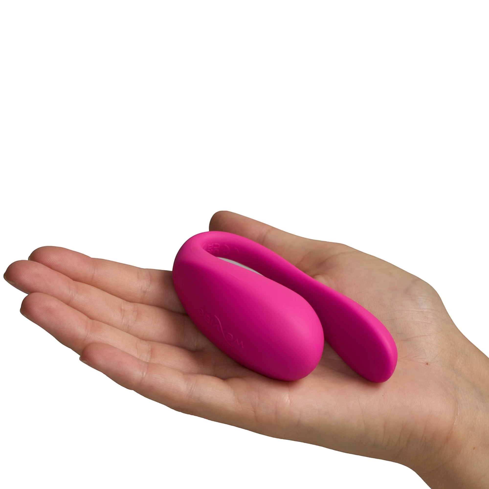 We-Vibe Jive 2 hot pink wearable love egg vibrator resting on open hand against white background