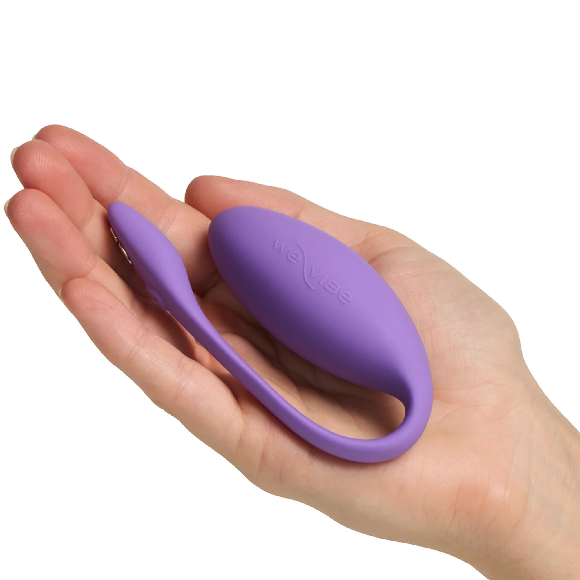 We-Vibe Jive Lite purple wearable love egg vibrator resting on open hand against white background