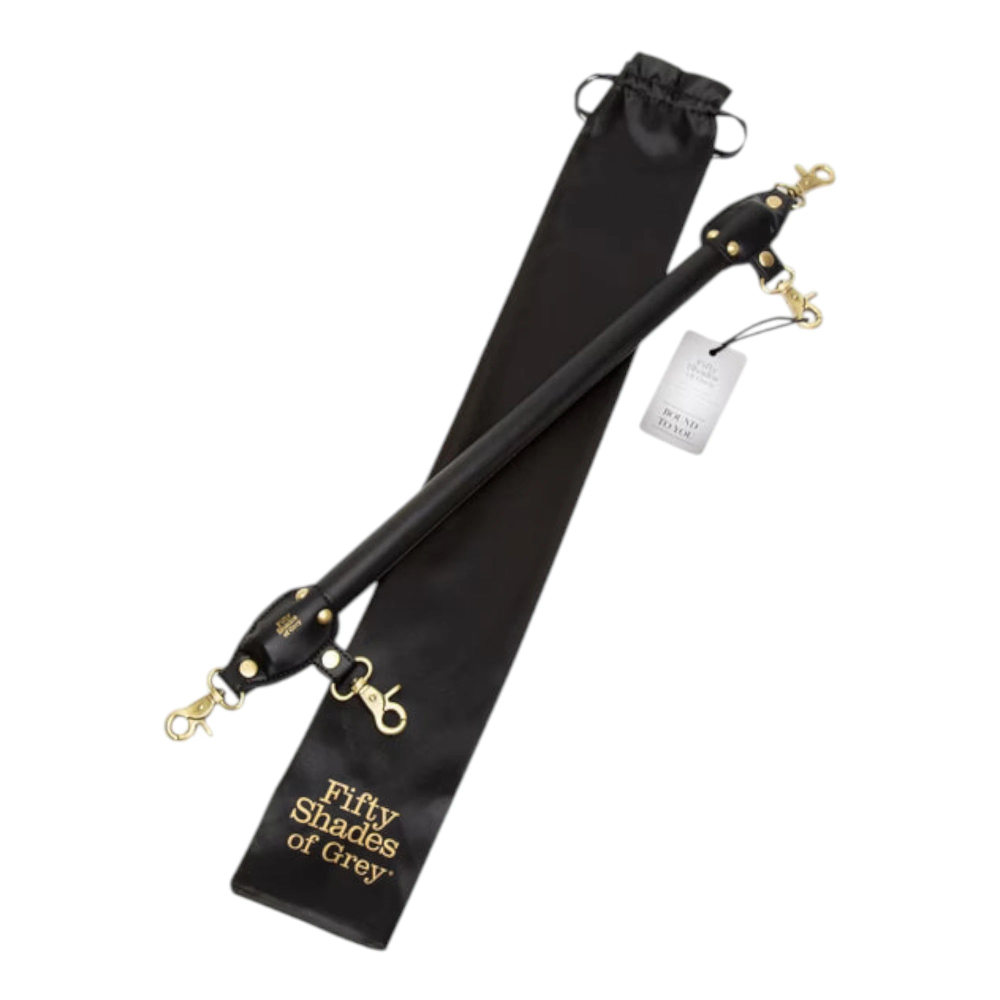Fifty Shades of Grey Bound to You faux leather spreader bar displayed with black satin storage pouch featuring drawstring closure and 'Fifty Shades of Grey' gold branding, product tag attached, showing black leather bar with gold-toned hardware and attachment clips against white background