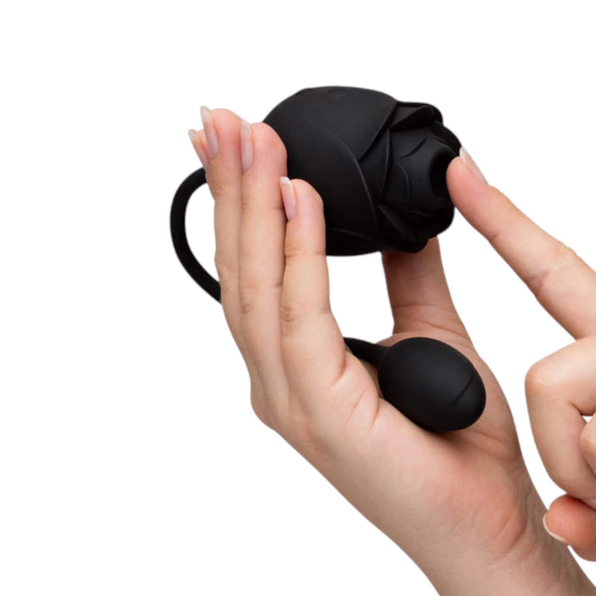 Fifty Shades of Grey Dark Blushing Rose clitoral suction stimulator and vibrating egg held in hands displaying black silicone rose-shaped suction head with petal detail, black remote control egg, connecting cord, and smooth finish against white background