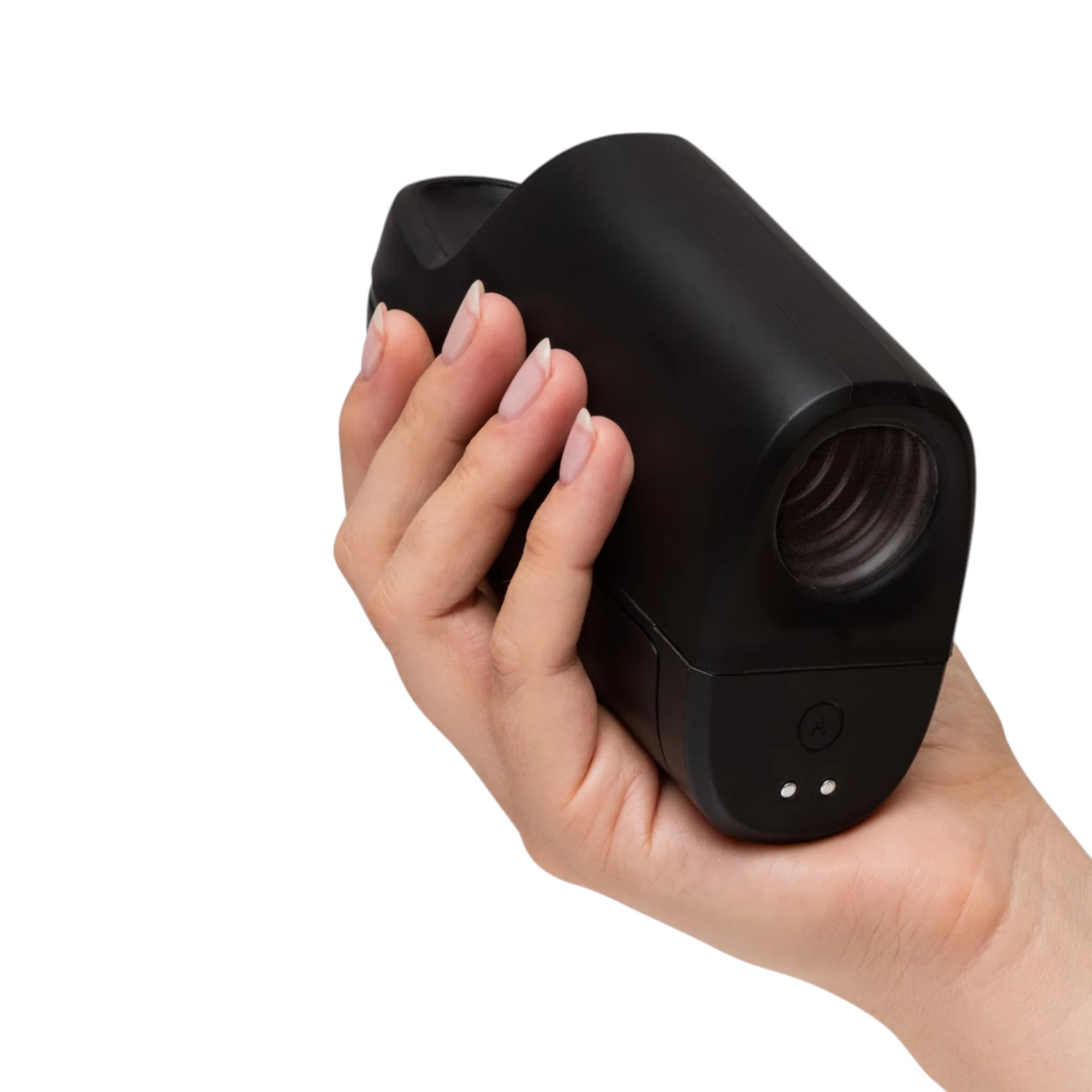 Arcwave Ion 2 black pleasure air male masturbator held in hand displaying compact rounded body, textured opening, and charging contacts against white background