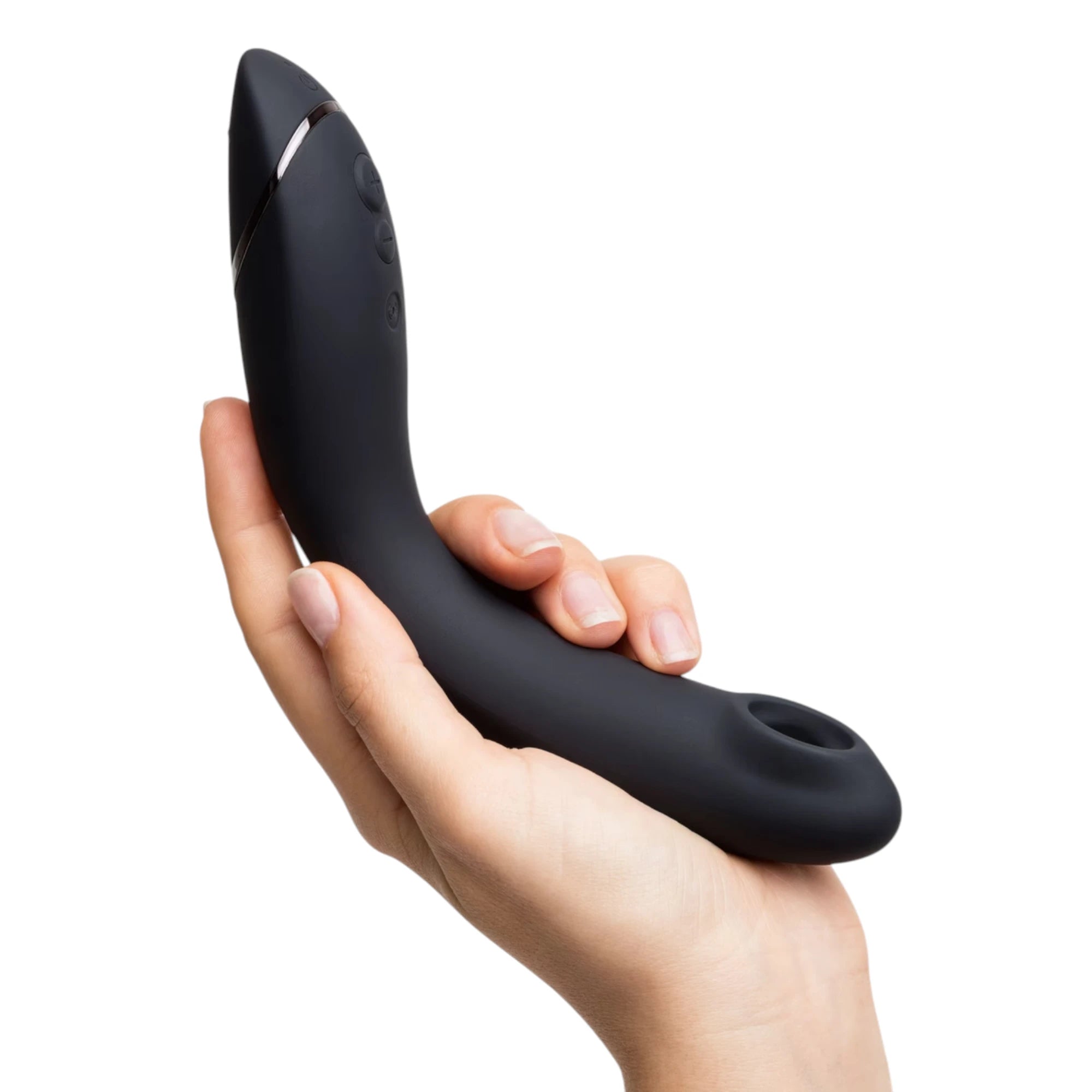 Womanizer OG Pleasure Air G-spot stimulator in black shown held in a hand, highlighting the curved ergonomic shape, metallic accent band, side control buttons and the Pleasure Air nozzle opening at the tip against a white background