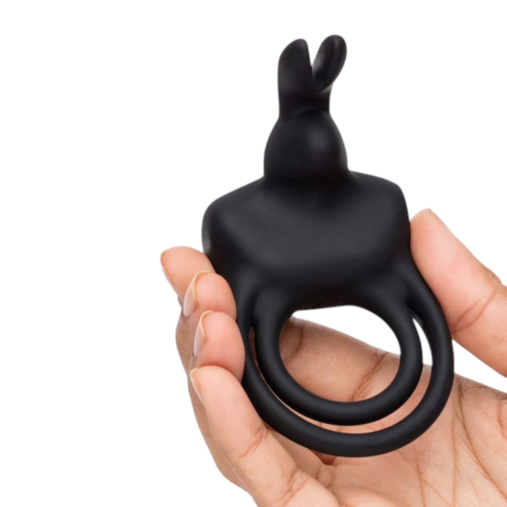 Happy Rabbit stimulating rabbit cock ring in black silicone held in hand displaying dual rabbit ear stimulator and flexible ring base against white background