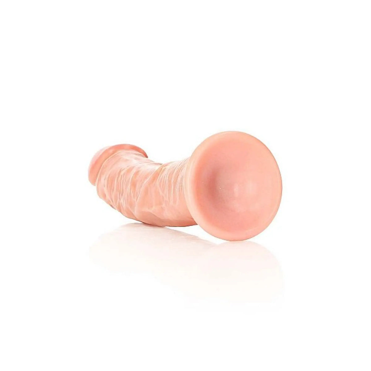 Real Rock curved realistic dildo with suction cup 7 inch lying on its side showing the suction cup base against white background