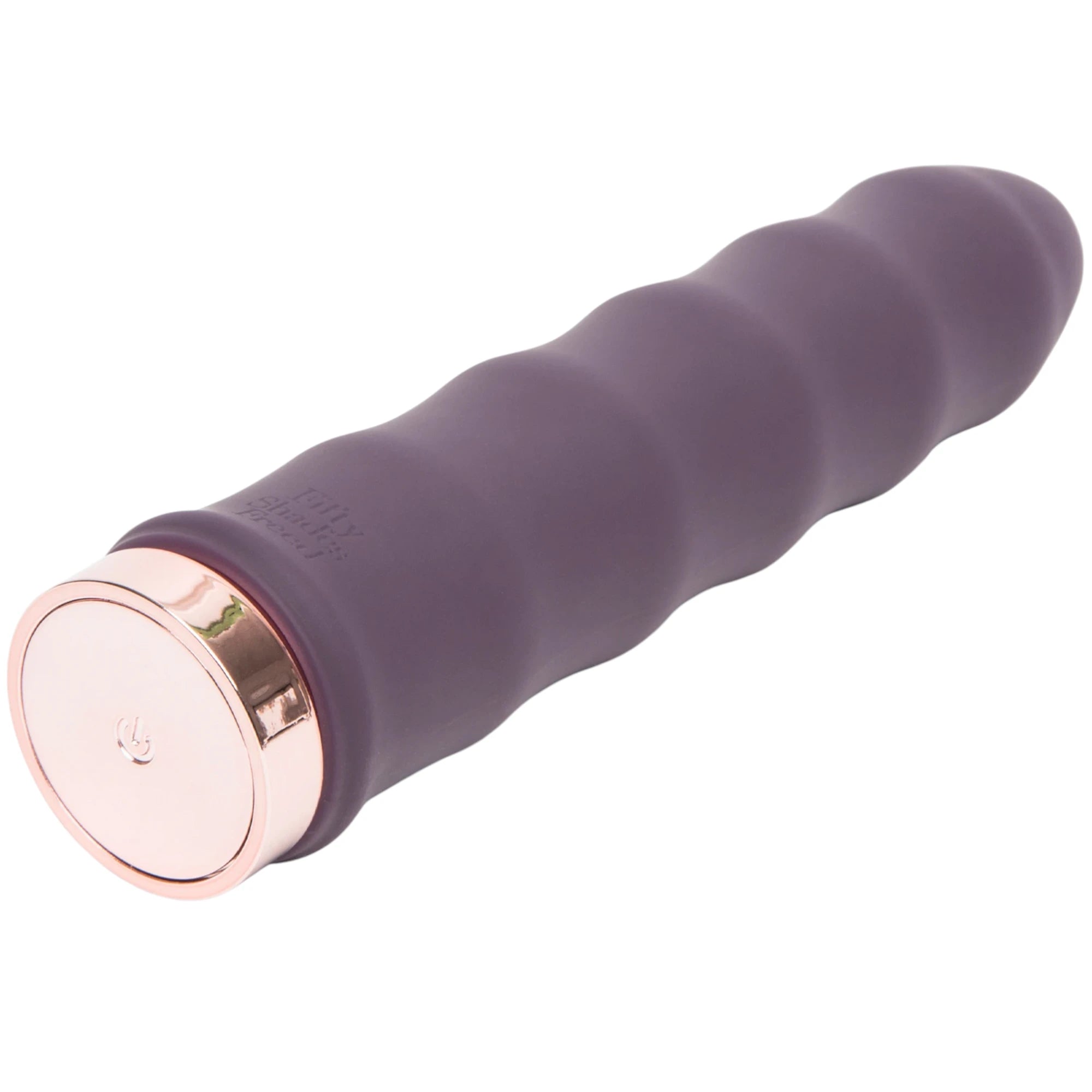 Fifty Shades Freed Deep Inside Classic Wave vibrator shown at an angle, featuring a purple silicone wavy ribbed shaft, rounded tip and a rose-gold base with a power button detail against a white background