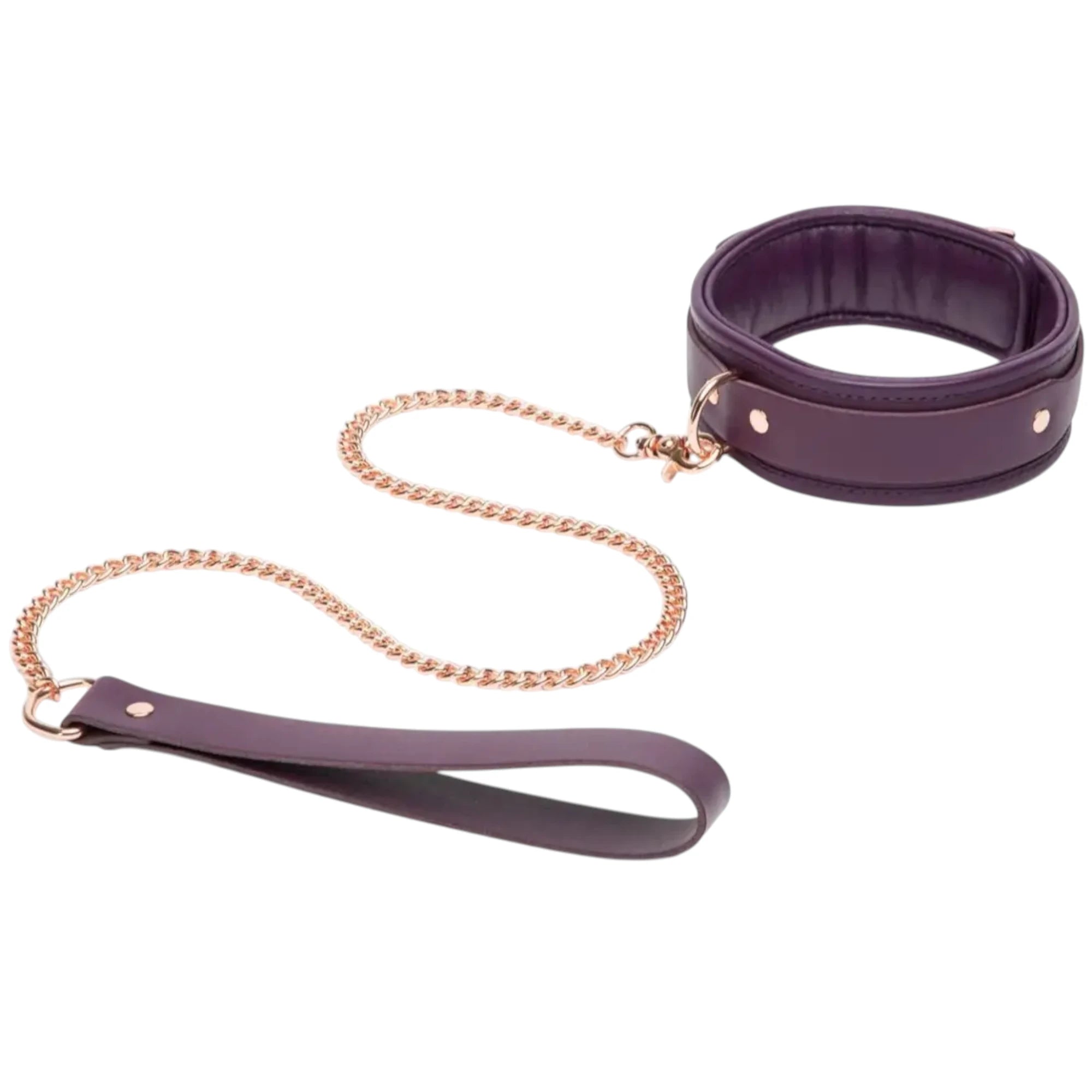 Fifty Shades Freed Cherished Collection leather collar and lead set in purple, shown with a padded collar featuring metal rivets and a rose-gold chain leash attached, plus a matching loop handle against a white background.