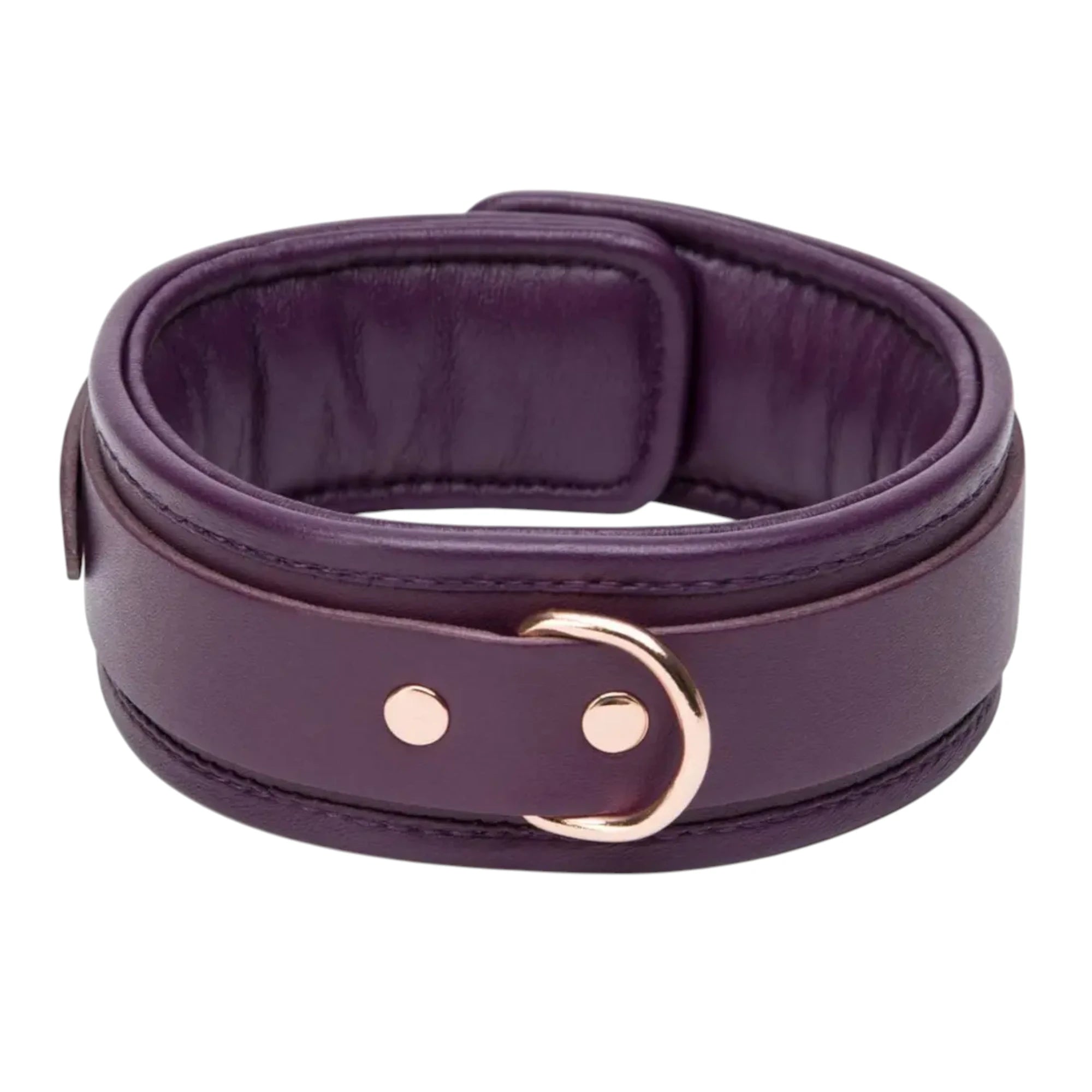 Fifty Shades Freed Cherished Collection leather collar shown coiled, featuring a purple padded interior, stitched edging and a rose-gold D-ring attachment with rivet details against a white background.