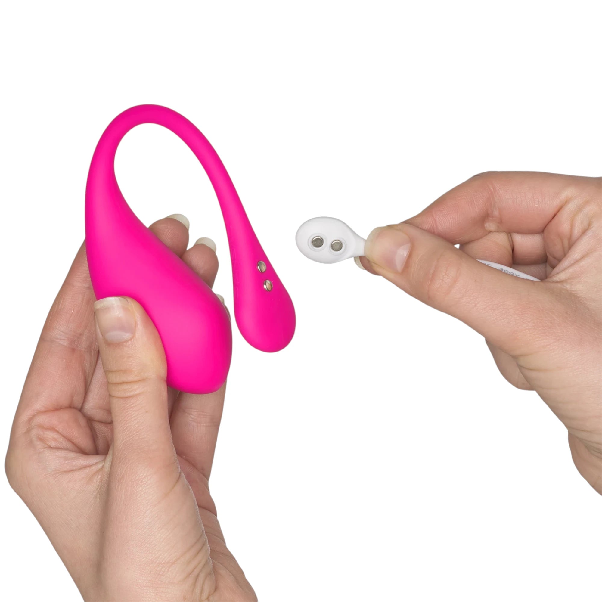 Lovense Lush 3 hot pink wearable egg vibrator held in hands displaying curved body with control buttons and white remote control against white background