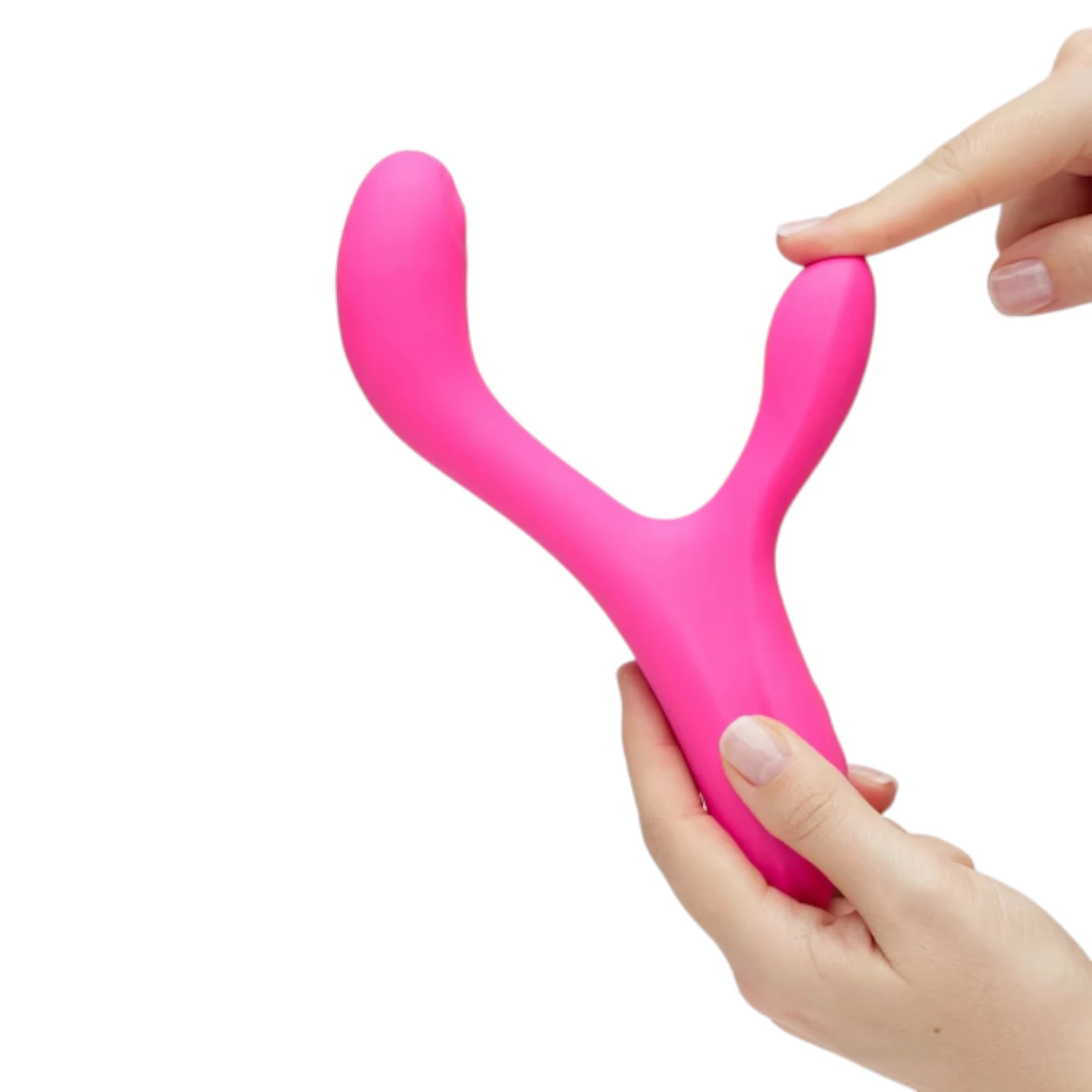Lovense Osci 3 warming rabbit vibrator in pink shown held in two hands, with a finger pressing the external arm to demonstrate flexibility and dual-stimulation shape against a white background.
