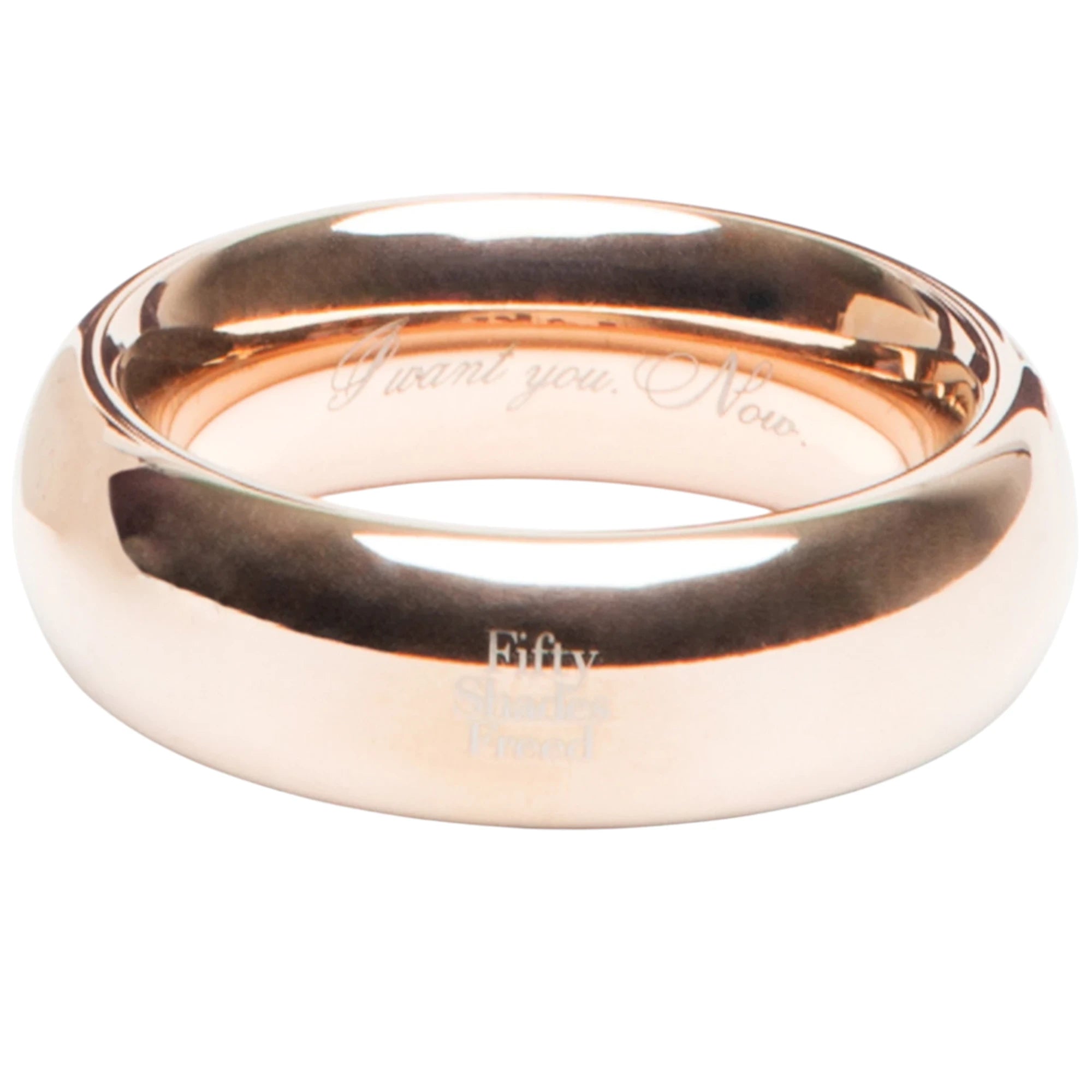 Fifty Shades Freed “I Want You Now” steel love ring shown in rose-gold finish, featuring a smooth rounded band with “Fifty Shades Freed” branding and the engraved “I want you. Now.” text visible inside against a white background.