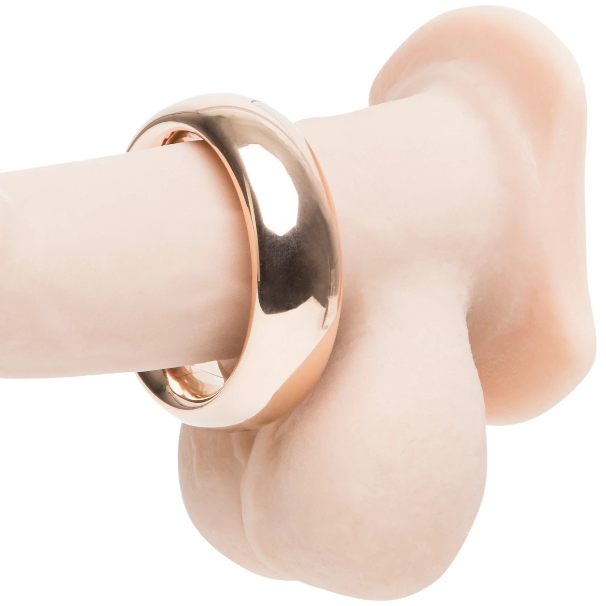 Fifty Shades Freed “I Want You Now” steel love ring in rose-gold finish shown on a silicone display, highlighting the smooth rounded band and wide fit against a white background.