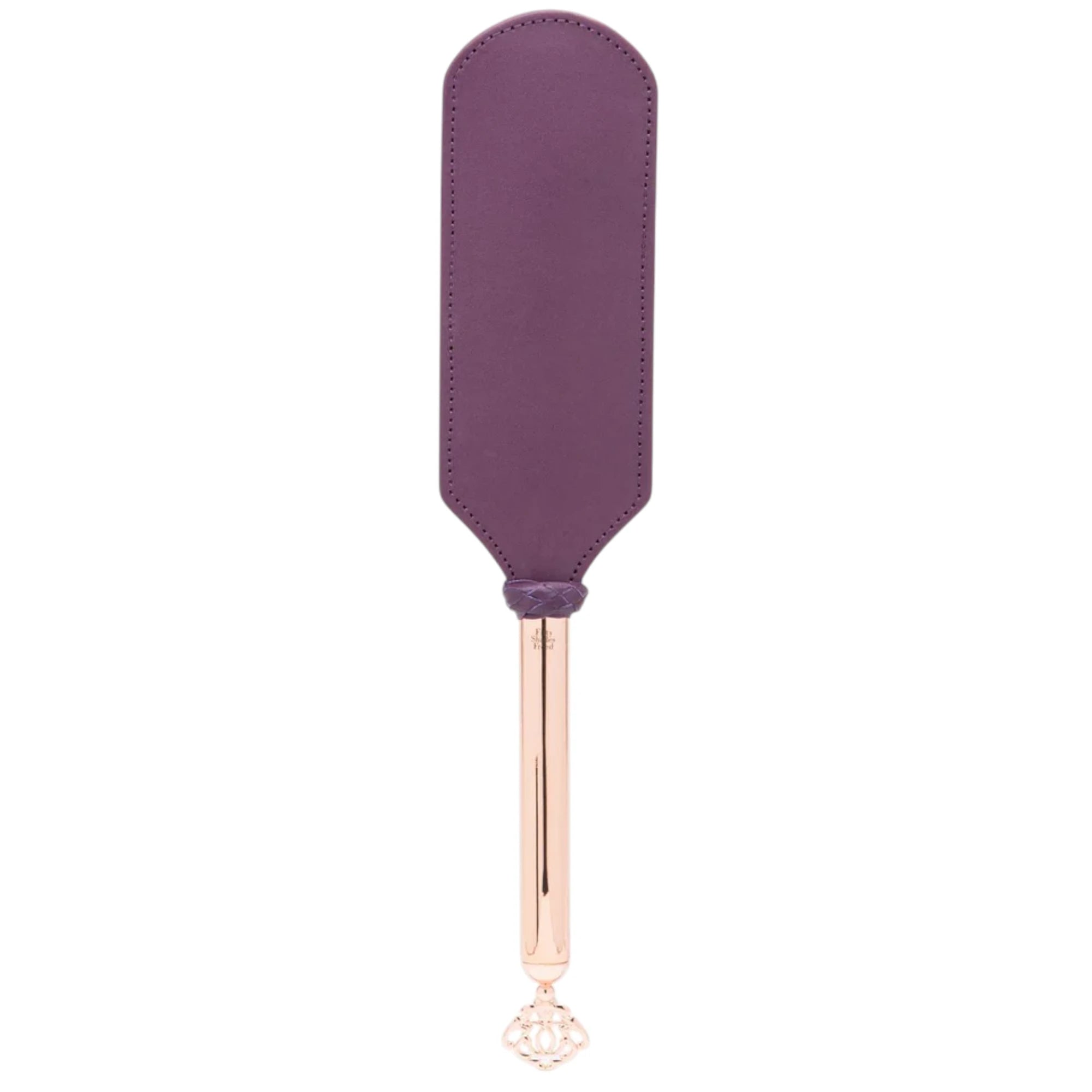 Fifty Shades Freed Cherished Collection leather and suede paddle shown full length, featuring a wide purple stitched paddle head and a rose-gold handle with braided grip detail and an ornate key-shaped charm at the end against a white background.