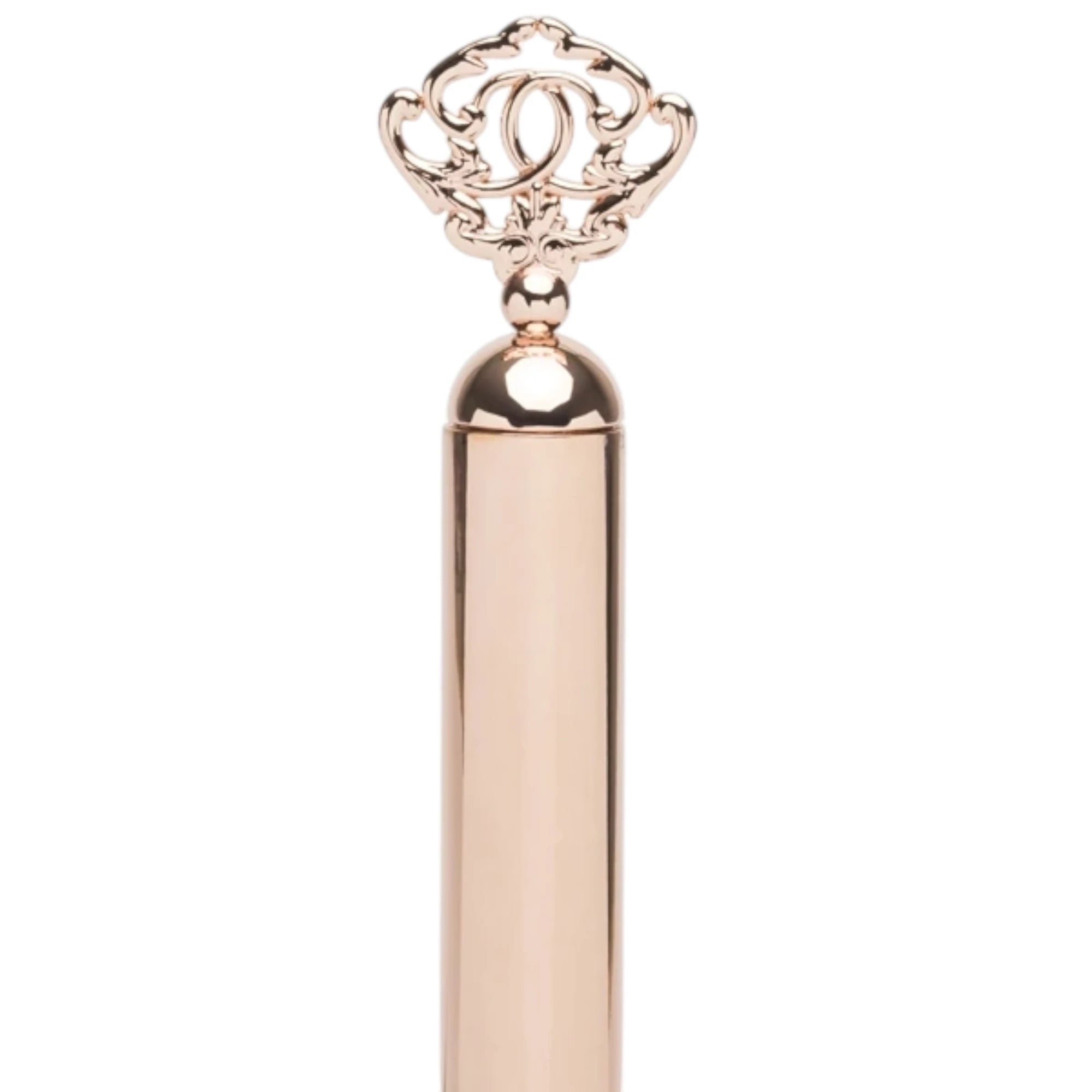 Close-up of the Fifty Shades Freed Cherished Collection flogger handle end, showing the rose-gold metal grip topped with an ornate key-shaped charm detail against a white background