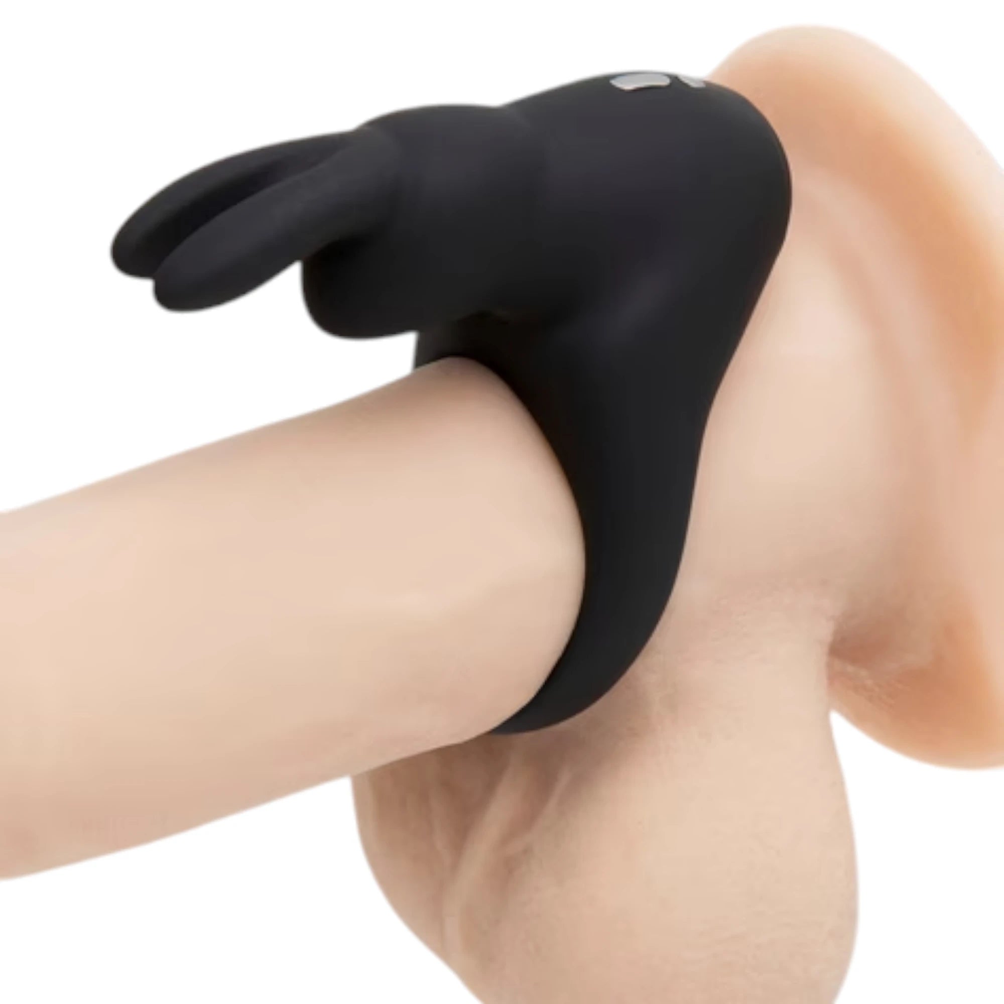 Happy Rabbit rabbit cock ring in black silicone worn on body displaying dual rabbit ear stimulators and flexible fit against white background