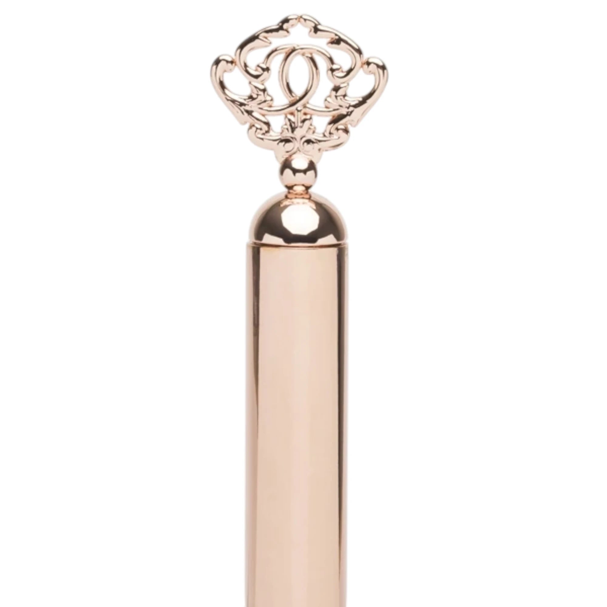Close-up of the Fifty Shades Freed Cherished Collection riding crop handle, showing the rose-gold metal grip and ornate key-shaped pommel detail against a white background.