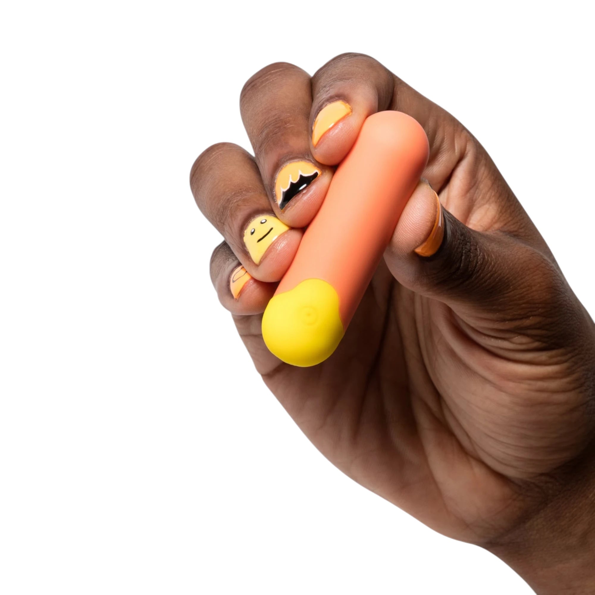 The ROMP Riot rechargeable silicone bullet vibrator in peach silicone with a smooth rounded body and a yellow base, shown held in a hand against a plain white background
