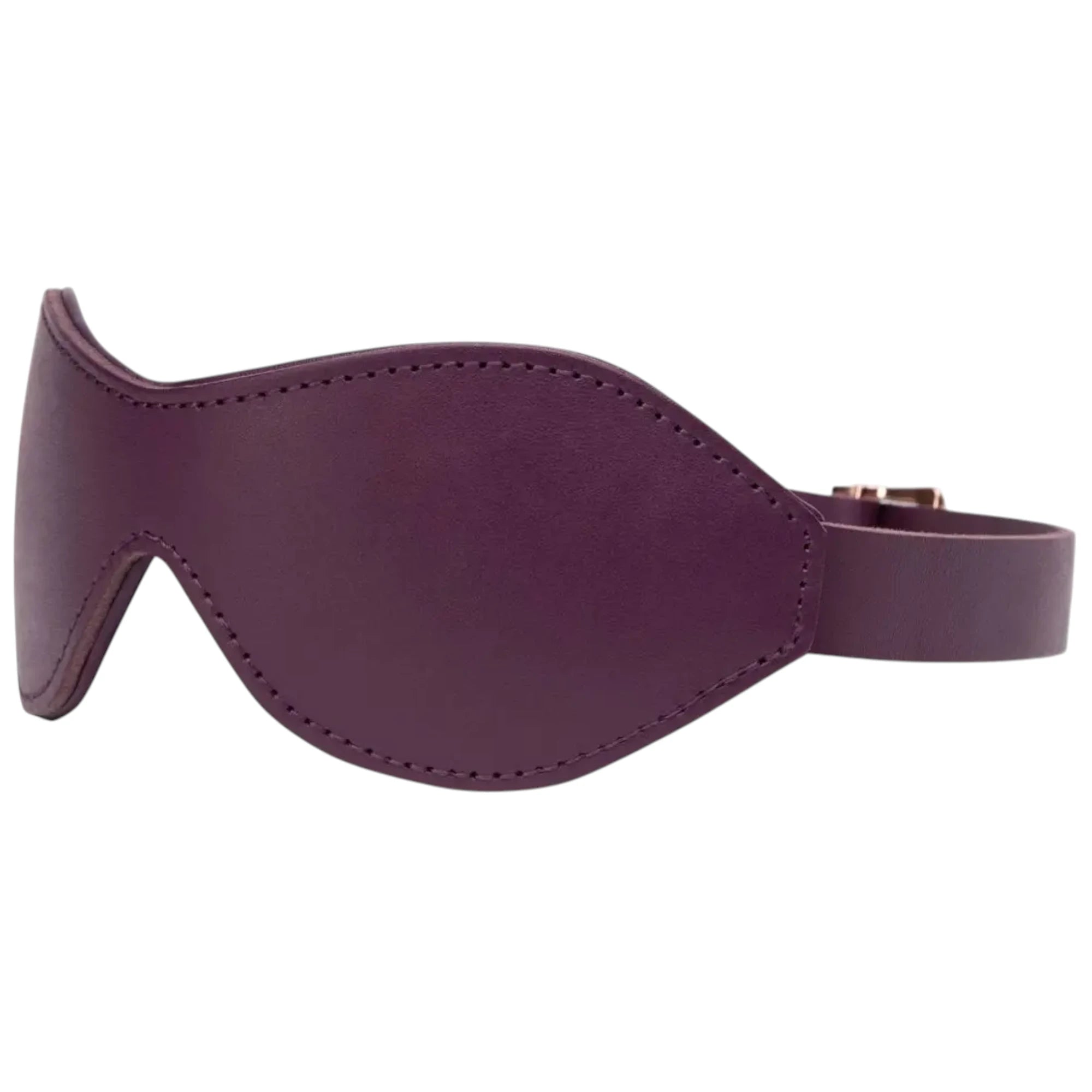 Side view of the Fifty Shades Freed Cherished Collection purple leather blindfold, showing the contoured stitched eye cover and the adjustable strap wrapping behind with buckle hardware partially visible against a white background