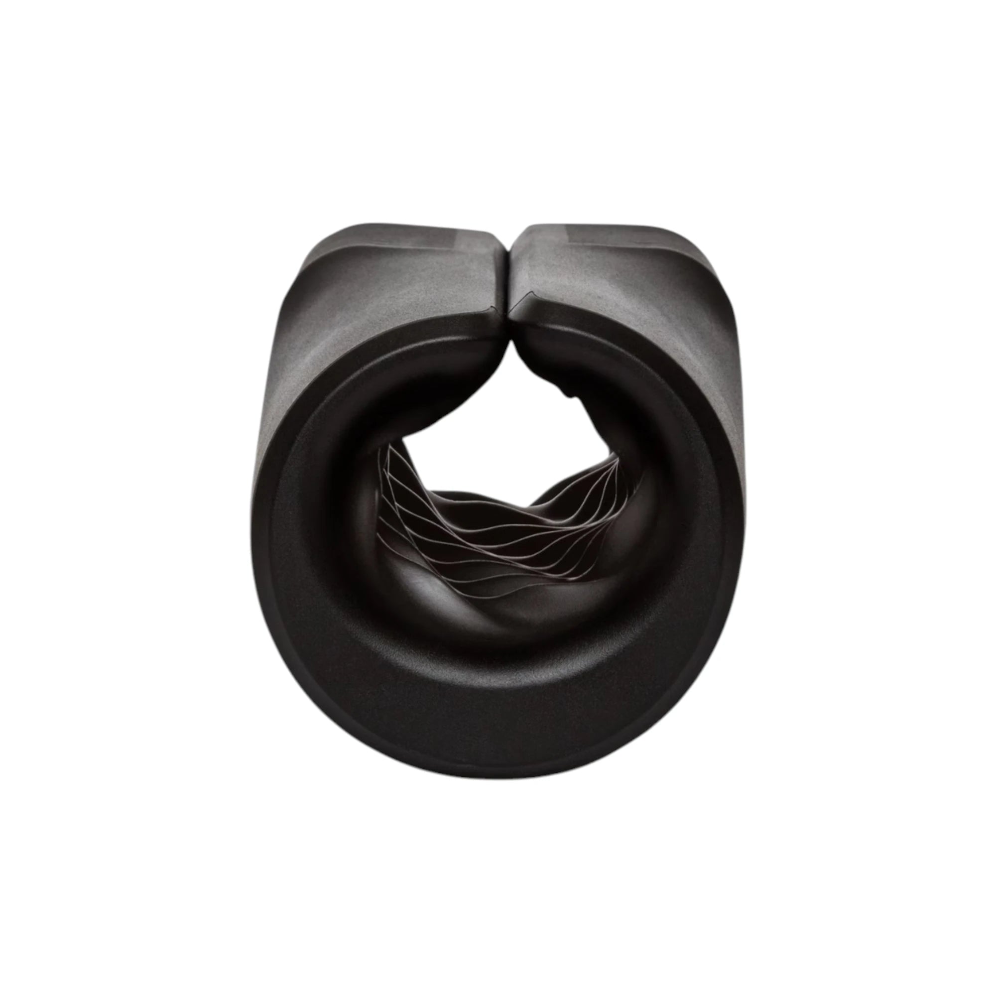Arcwave Zing black vibrating male masturbator shown from above displaying dual-entrance openings with textured interior ridges against white background