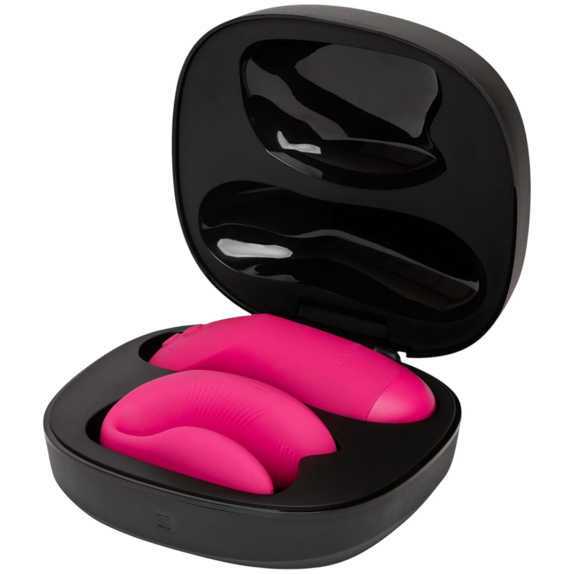 We-Vibe Chorus Pro couple vibrator in hot pink displayed in black storage case shown from above displaying dual curved bodies with textured ridges, smooth silicone finish, and protective carrying case with magnetic closure against white background