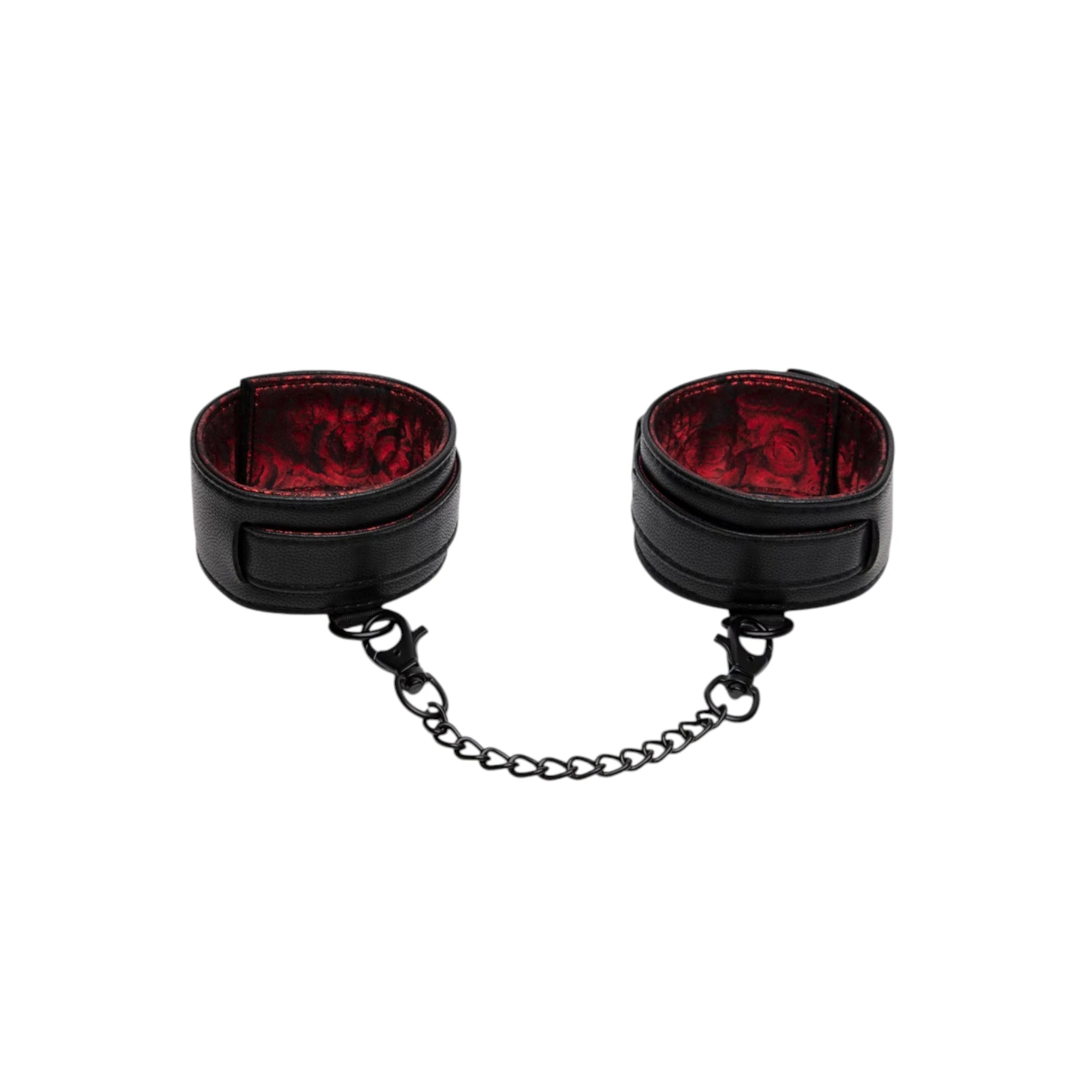 Fifty Shades of Grey Sweet Anticipation ankle cuffs shown from front displaying black leather cuffs with red velvet lining, metal chain connector, and adjustable straps against white background