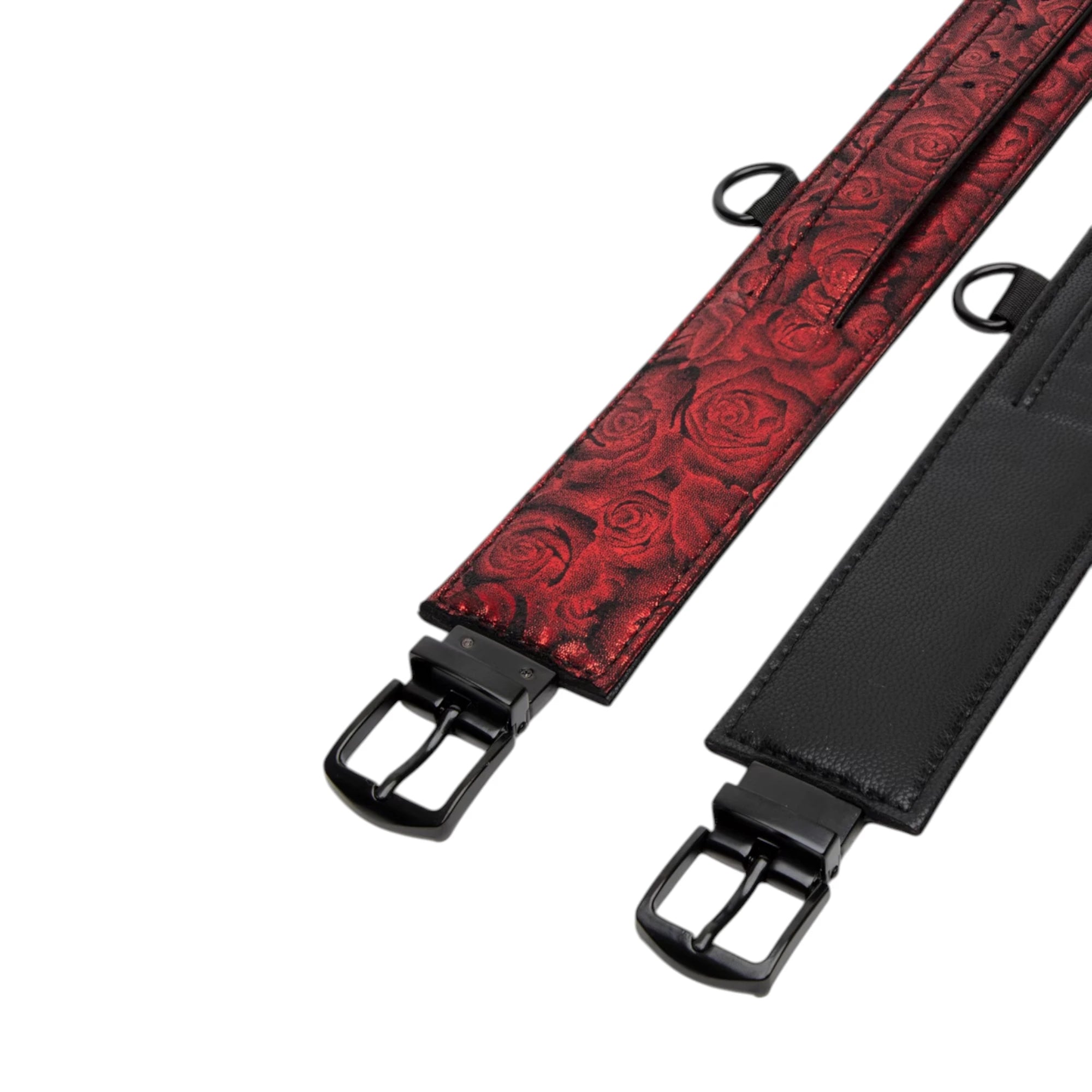 Fifty Shades of Grey Sweet Anticipation bondage belts shown from above displaying burgundy damask patterned belt and black leather belt with metal buckle closures and D-ring attachment points against white background