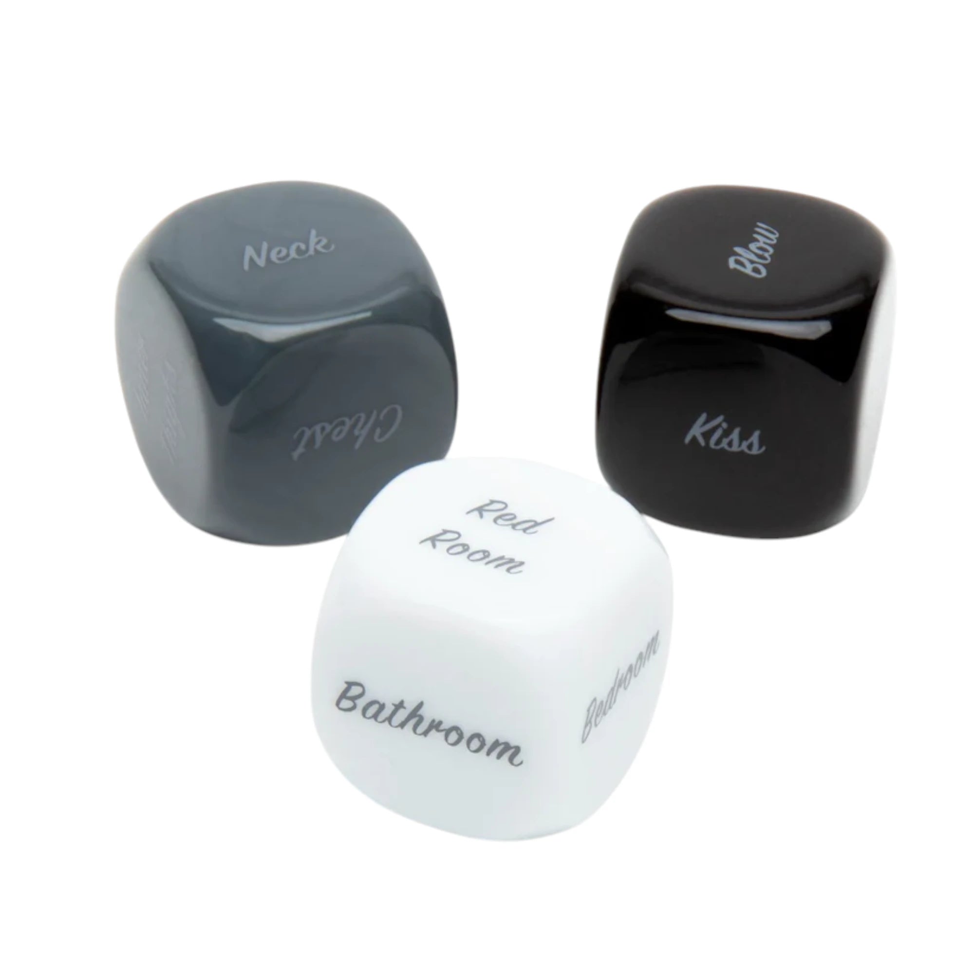 Fifty Shades of Grey Play Nice kinky dice for couples shown from above displaying three engraved dice in grey, black, and white with text options including Neck, Blow, Kiss, and Bathroom against white background