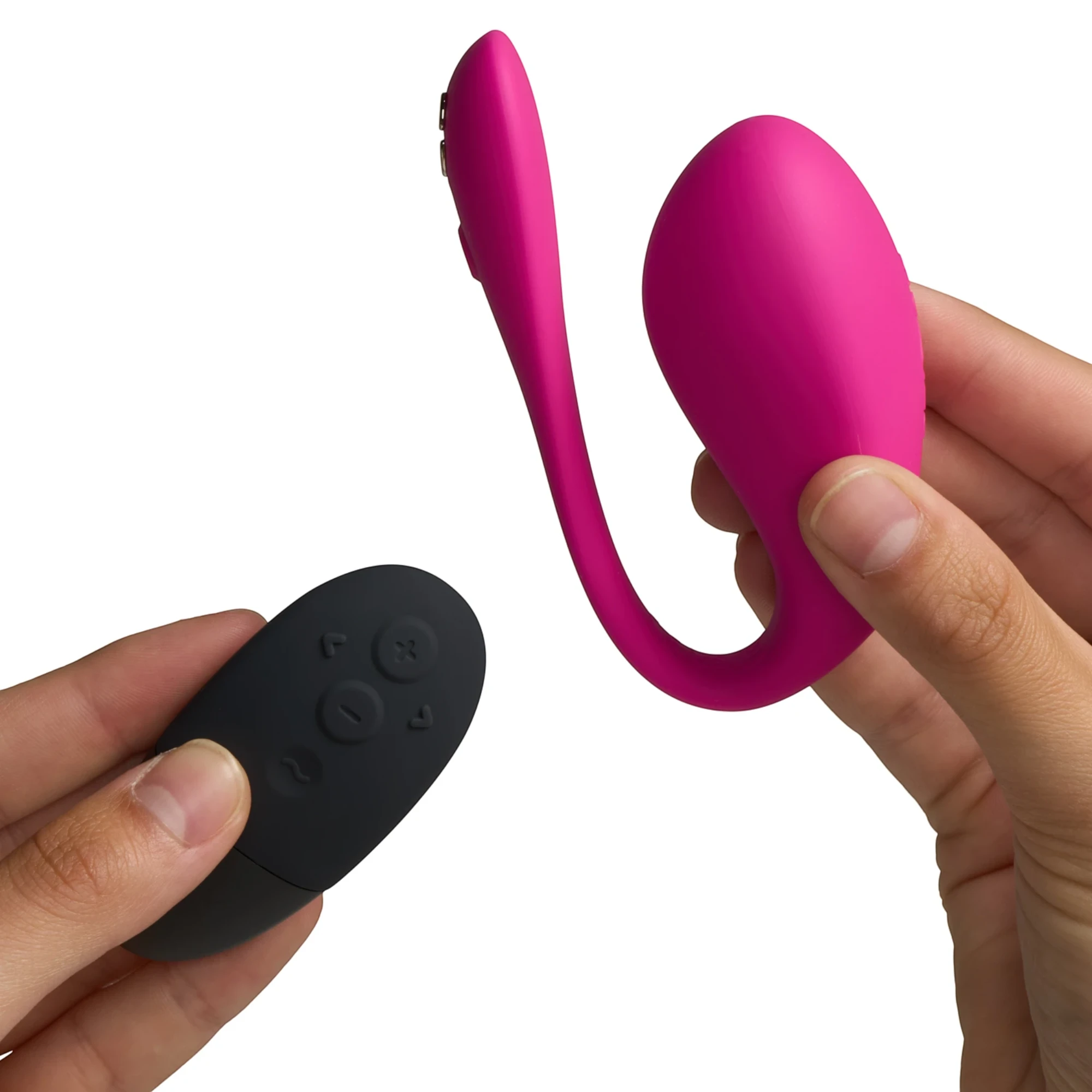We-Vibe Jive 2 hot pink wearable love egg vibrator with black wireless remote held in hands against white background
