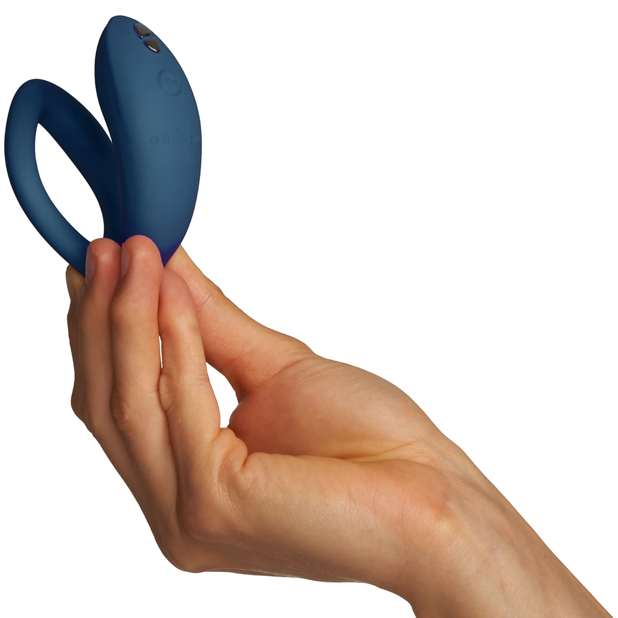 We-Vibe Sync O navy blue couples vibrator held in hand showing shape and control button against white background