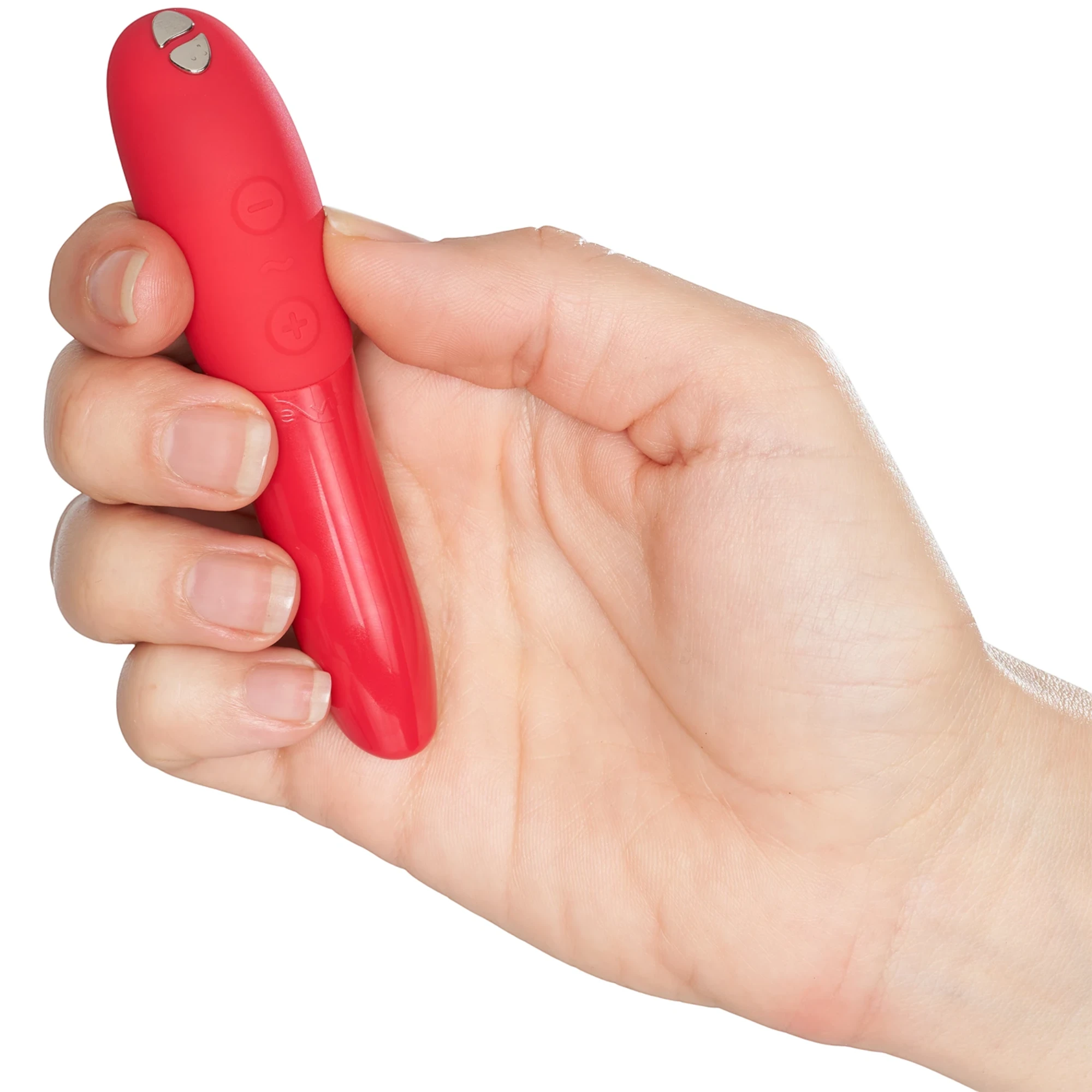 We-Vibe Tango X red lipstick bullet vibrator held in hand against white background
